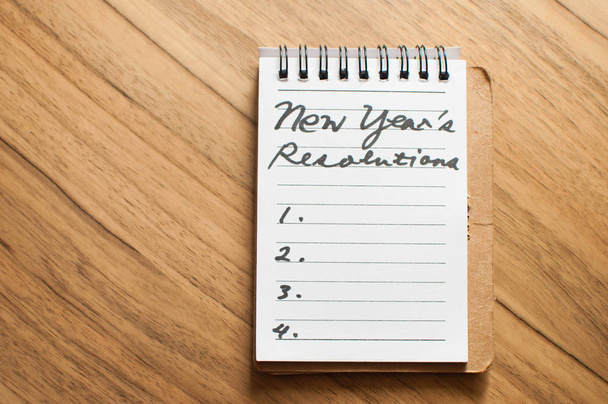 Νέα χρόνια ψήφισμα χειρόγραφη σε ένα σημειωματάριο - Φωτογραφία, εικόνα