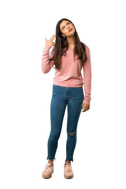 A full-length shot of a Teenager girl with pink shirt with problems making suicide gesture - Foto, Imagem