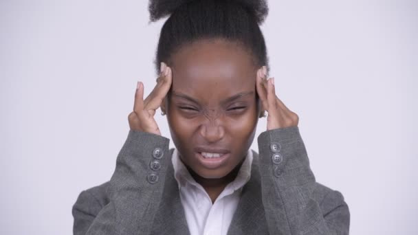 Face of young stressed African businesswoman having headache - Felvétel, videó