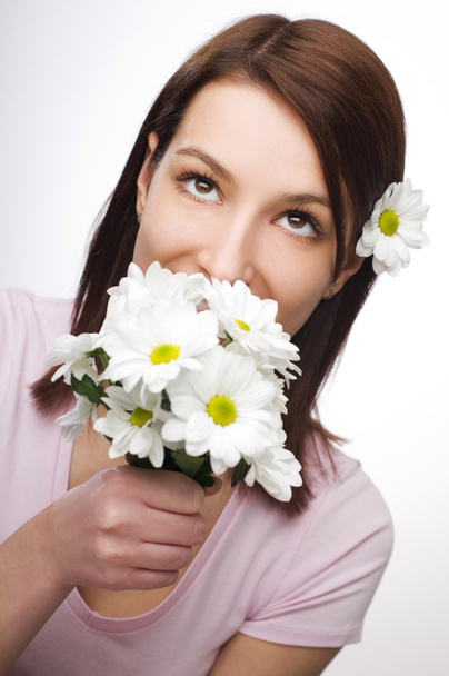 Smelling flowers - Фото, изображение
