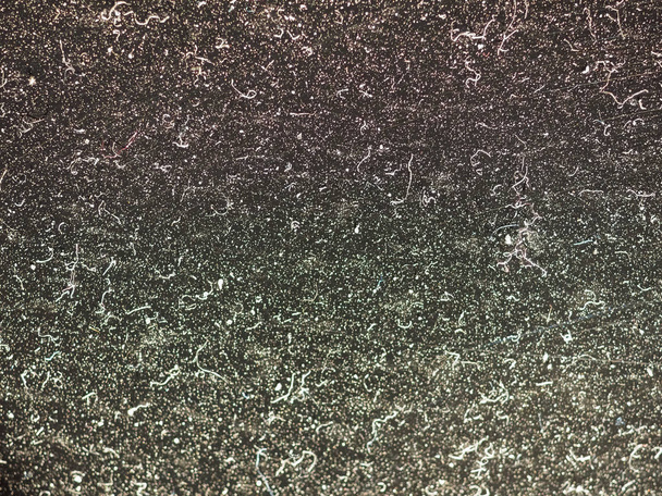 partículas de poeira branca sobre um fundo escuro
 - Foto, Imagem
