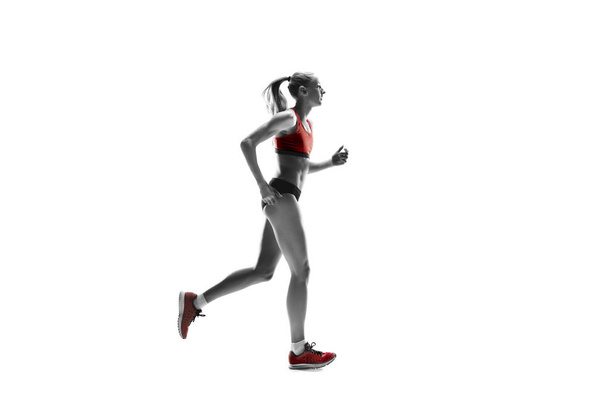 one caucasian woman running on white background - Photo, image
