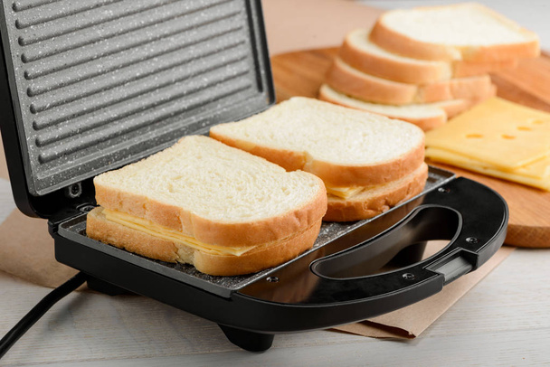 Sandwiches in a panini maker - Photo, Image