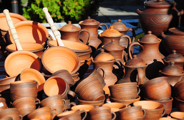 Traditional clay dish. Showcase of handmade ceramic pottery. - Photo, Image