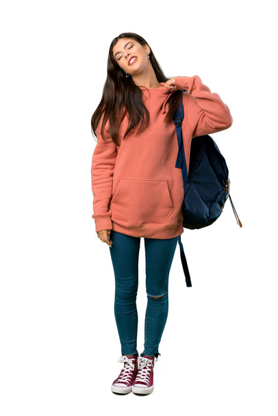 Una foto completa de una adolescente con sudadera y mochila con expresión cansada y enferma
 - Foto, Imagen