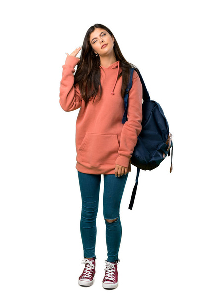 A full-length shot of a Teenager girl with sweatshirt and backpack with problems making suicide gesture - Foto, afbeelding