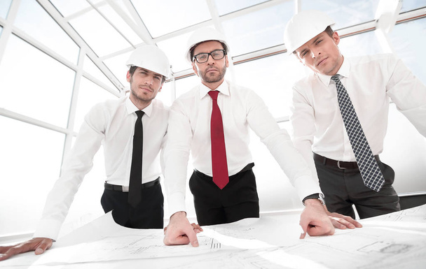 group of architects standing in front of the Desk - Foto, imagen