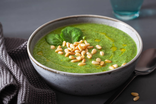 green creamy cauliflower spinach soup on gray background - Photo, Image