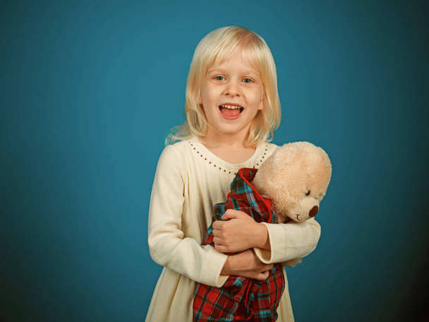 My favorite childhood toy. Little girl with teddy bear. Small girl hold toy bear. Little child with soft toy. Small kid happy smiling. Happy childhood. I love my teddy - Zdjęcie, obraz