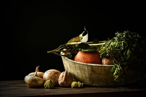 assorted vegetables in the wooden bowl with black background - closeup - Fotoğraf, Görsel