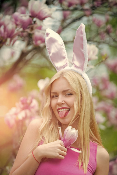woman or cute girl with bunny ears at magnolia - Zdjęcie, obraz