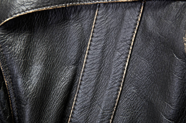 Detail of old leather motorcycle jacket focusing on seams and stitching - Photo, Image