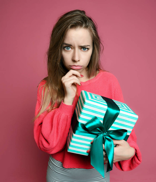 Beautiful woman with shopping presents gift box for happy valentines day on pink  - Photo, image