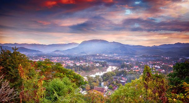 Beautiful stunning sunset in Luang Prabang Laos, from Mount Phusi. Laos is a popular travel destination in Southeast Asia - Photo, Image