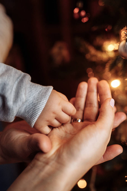 Happy young mother and son  decorating  Christmas tree - Foto, Imagem