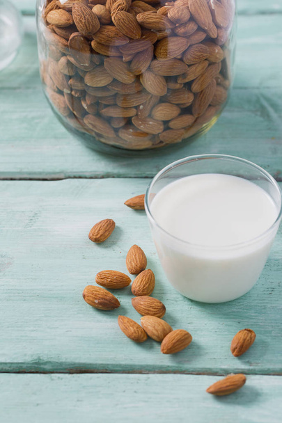 glass of almond milk on wooden surface - Foto, Bild