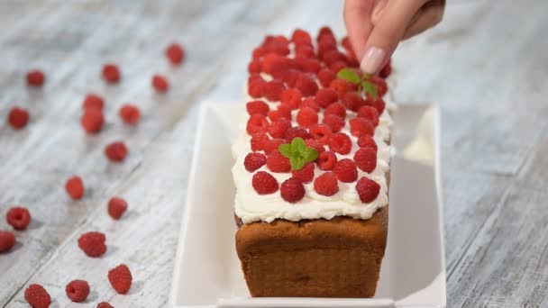 Cake with raspberries and mint leaves. - Footage, Video