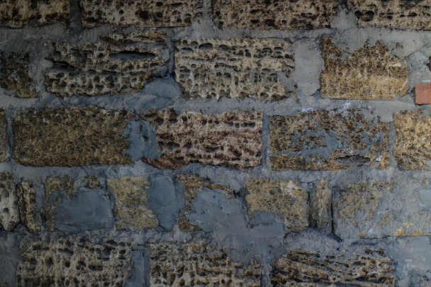 текстура натурального каменю. фон з черепашкового каменю. кам'яна стіна з цементом
 - Фото, зображення