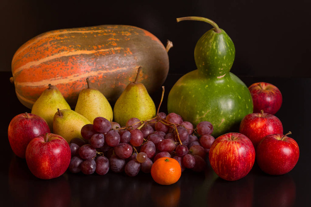 fruits on a dark background, studio picture - Photo, Image