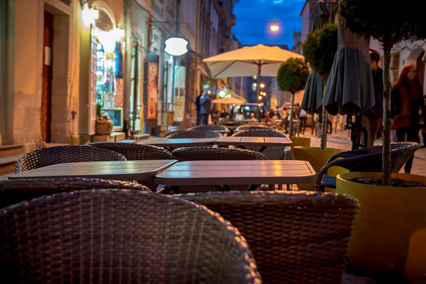 Summer tables of the evening street cafe - Photo, image