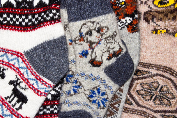 Calcetines de punto de lana en stock.Background de calcetines de lana caliente
. - Foto, imagen