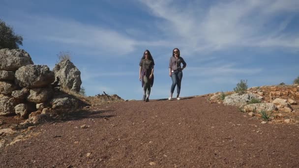 Young women standing in the centre of rubble road - Filmmaterial, Video
