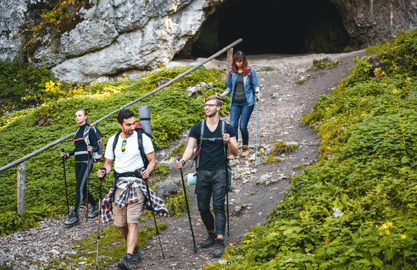 Group of hikers exploring mountain, trekking in nature - Foto, imagen