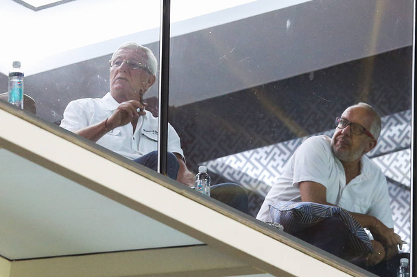 Head coach Marcello Lippi, left, of the Chinese national men's football team watches the 19th round match between Guangzhou Evergrande and Guangzhou R&F during the 2017 Chinese Football Association Super League (CSL) in Guangzhou city, south China's  - Foto, Imagen