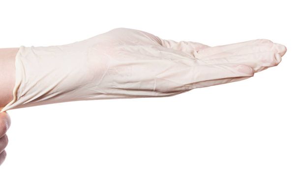 vista lateral de la mano tira del guante de látex en la palma aislada sobre fondo blanco
 - Foto, Imagen