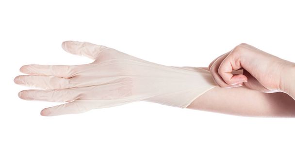 top view of female hand wears latex glove on another hand isolated on white background - Photo, Image