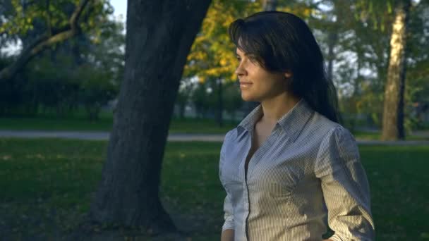Portrait Beautiful Happy Woman Watching Sunset Smiling. Autumn Evening Golden Hour In Park - Filmmaterial, Video