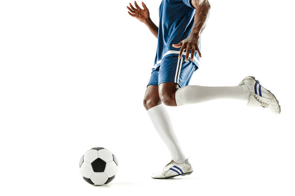 legs of soccer player close-up isolated on white - Φωτογραφία, εικόνα