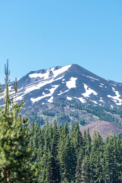 Close up view of Mt Bachelor in the summer in Bend Oregon on a sunny day. Snow still on the mountain - Photo, Image
