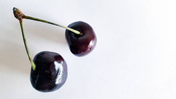 Cherries. Fresh cherry on a white background - Zdjęcie, obraz