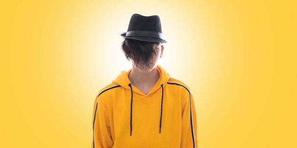 young fashioned teenager isolated in yellow background - Photo, Image