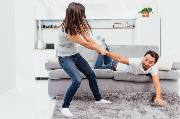 The wife throws her husband out of the sofa - Photo, Image