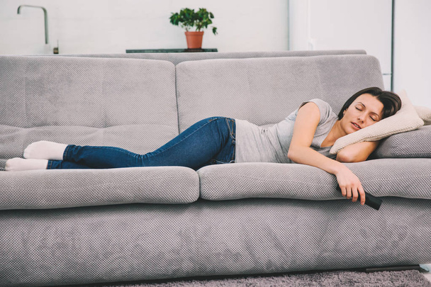 Beautiful young woman sleeping on sofa. - Zdjęcie, obraz