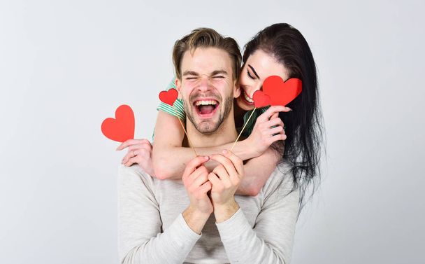 Romantic ideas celebrate valentines day. Man and woman couple in love hug and hold red heart valentines cards close up. Valentines day concept. Man and pretty girl in love. Valentines day and love - Foto, Bild
