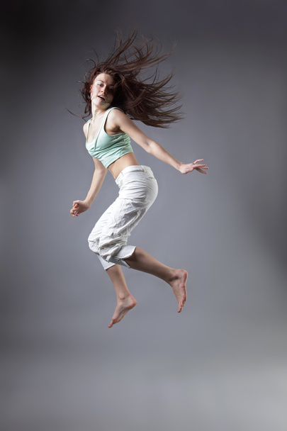 beauty girl dance on grey background - Valokuva, kuva