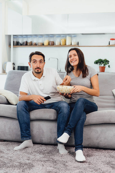 Husband and woman sitting on the couch - Foto, Imagen