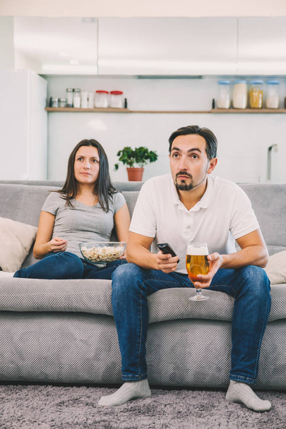 Husband and woman sitting on the couch - Photo, Image