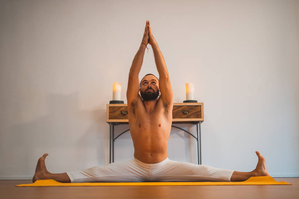Yoga. Young man doing yoga exercise. Yoga lifestyle healthy concept. - Photo, Image