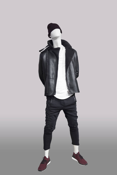 Full-length male mannequin dressed in black warm fur jacket, isolated. No brand names or copyright objects. - Foto, Imagem