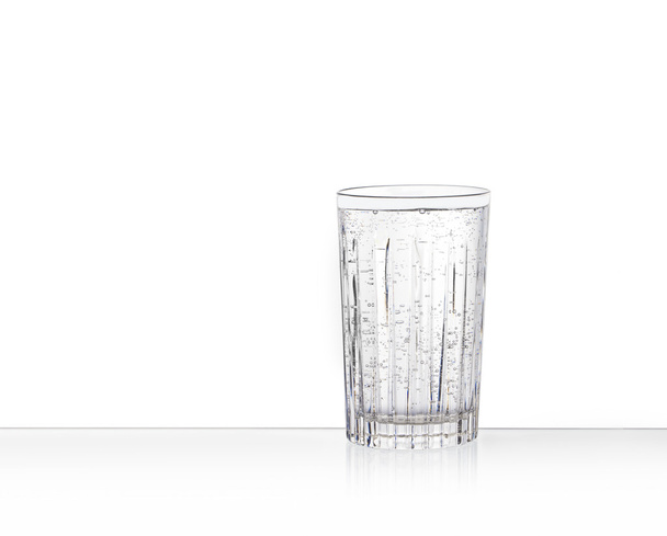 One clear glass with sparkling water - Photo, Image