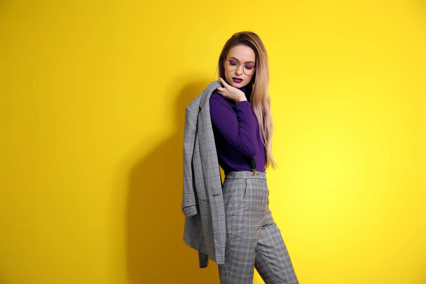 Fashionable young woman on color background - Photo, Image