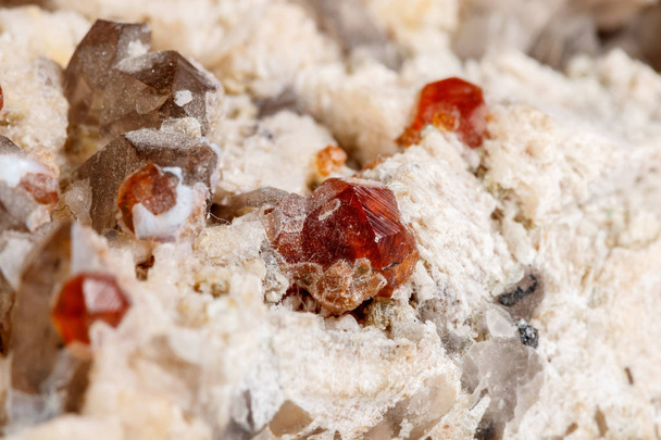 Macro mineral stone Spessartine, Feldspar, Smoky quartz, on a white background close up - Photo, Image
