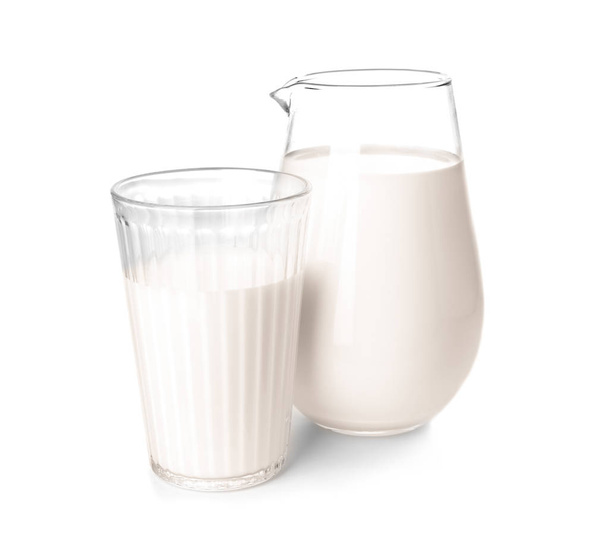 Jug and glass of fresh milk on white background - Foto, Imagen