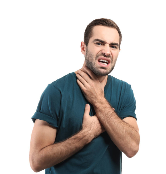 Młody mężczyzna o ataku na białym tle astmy - Zdjęcie, obraz
