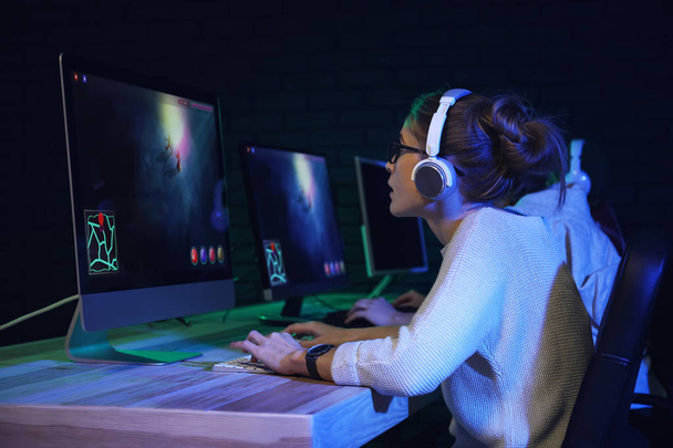 Young women playing computer game in club - Photo, Image