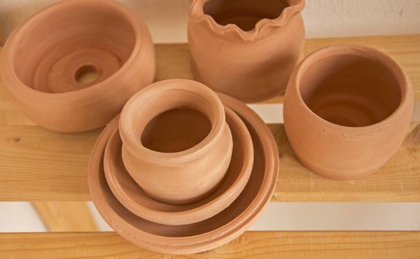 Several bisque-fired wessels prepare to decorating - Photo, Image